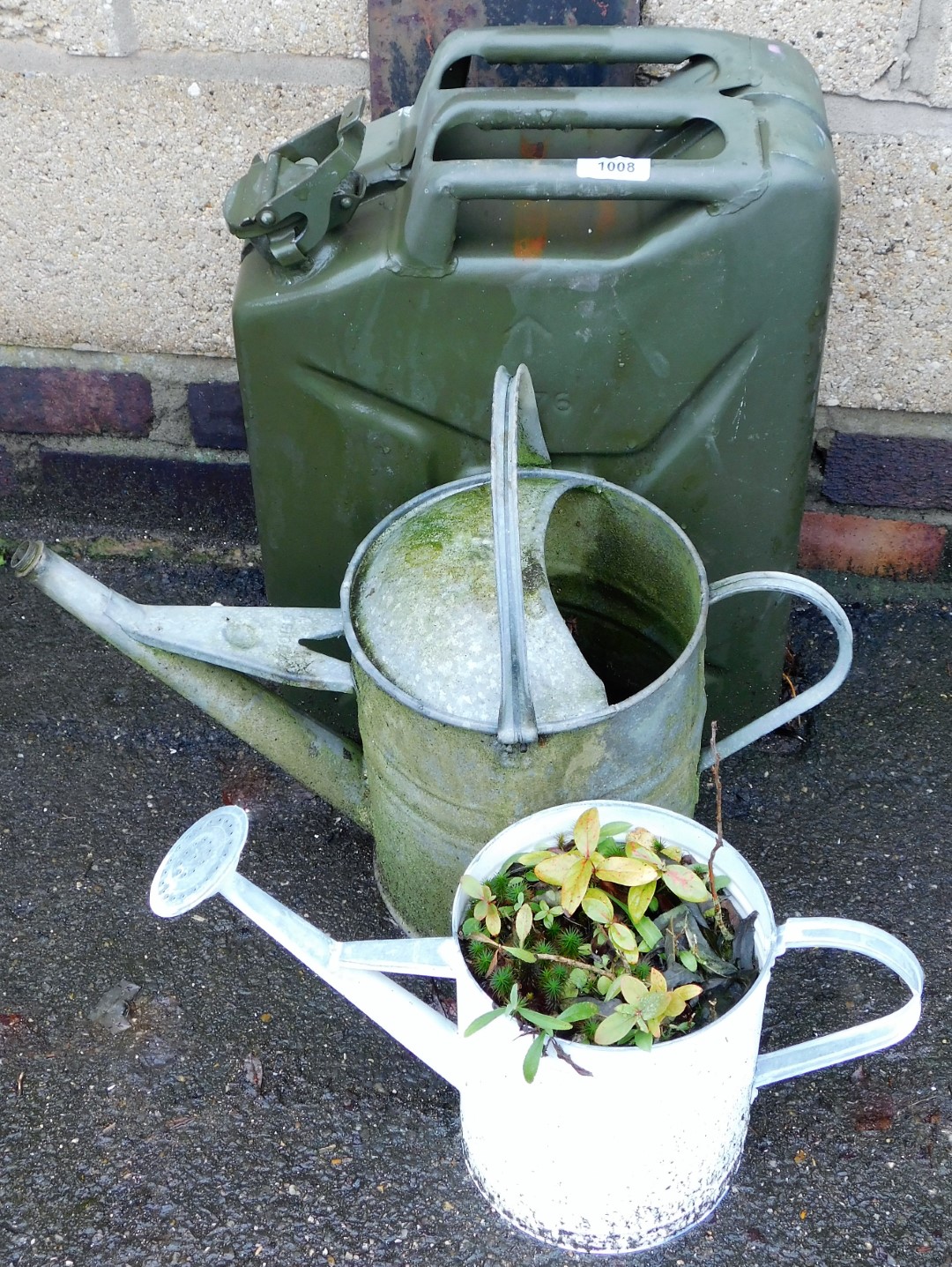A military oil can and two watering cans. (3)