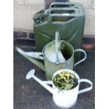 A military oil can and two watering cans. (3)