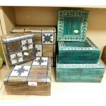 A group of storage/trinket boxes, comprising two graduated sets, one of wooden design with metal