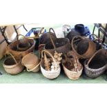 A large quantity of wicker baskets, one bike basket, etc. (all under one table)