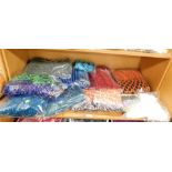 A quantity of knitted wares, to include scarves and throws, etc., of varying colours and weaves. (