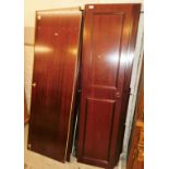 A mahogany finish double wardrobe, flat packed.