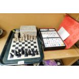 A soapstone chess set and a Chinese mahjong set, cased. (2)