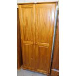 A pine two door wardrobe, 180cm high, 76cm wide, 48cm deep.
