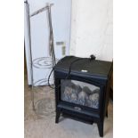 A Dimplex electric heater and a five tier saucepan stand. (2)