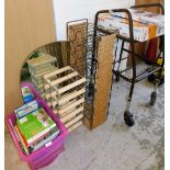 A group of furniture, books and effects to include a wall mirror, two wine racks, a mobility walker,