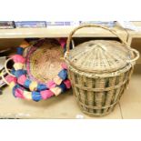 Three wicker storage canisters, to include a pair of coloured wicker and coconut fibre detailed