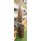 A large woven basket with assortment of wicker twigs, a glass bowl on metal stand. (2)