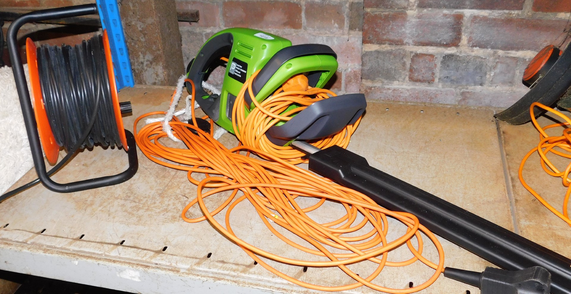 An electric hedge trimmer, 550w, serial number PWR550HTA.