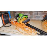 An electric hedge trimmer, 550w, serial number PWR550HTA.