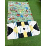 *Two rugs/mats, to include a Carplane mat and a multicoloured rug. (2)