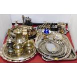 A group of silver plated wares, to include part tea service, toast rack, trays, candlesticks,