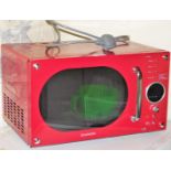 A Daewood microwave, in red, 800w.