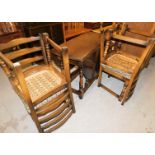 An Old Charm oak finish extending drop leaf dining table and set of four chairs, the dining table