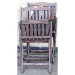 *Two stained teak slatted patio chairs.