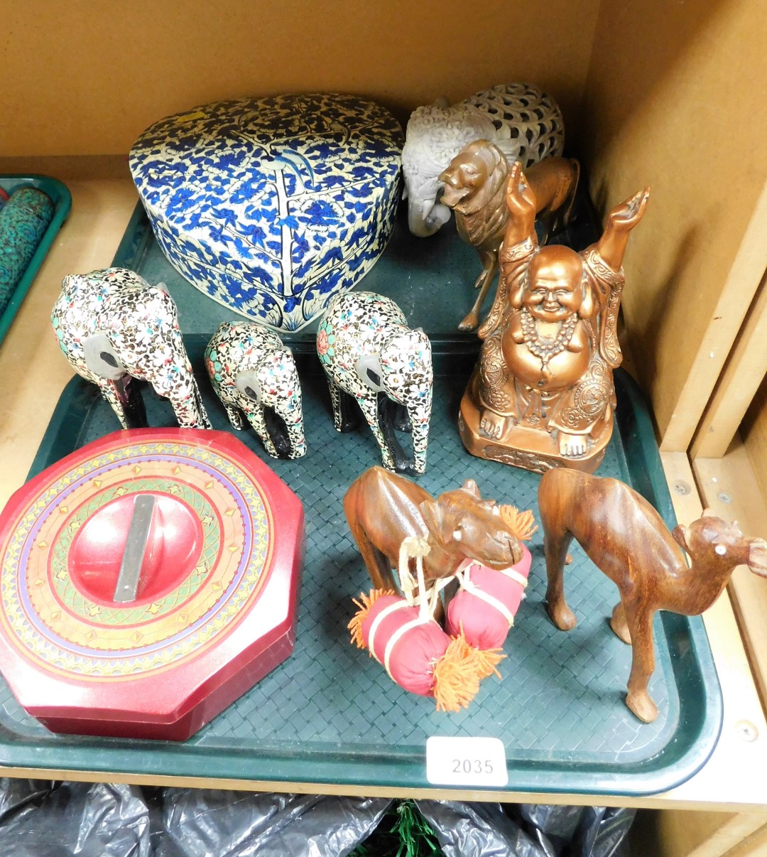 Various Eastern and other ornaments and storage jars, to include a graduated set of three wooden