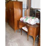 A mid 20thC walnut finish bedroom suite, comprising two wardrobes, bedside table and a dressing