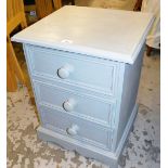 A painted pine three drawer bedside cabinet, painted in blue with three single drawers, 60cm high,