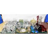 A large group of glassware, to include champagne flutes, wine glasses, coloured glass goblets, scent