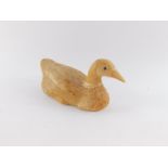 A straw figure of a duck, modelled with realistic eyes, 22cm wide.