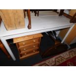 A white melamine extending dining table, 71cm high, 137cm wide, 184cm extended, 82cm deep., a walnut