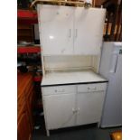 A 1950's kitchen larder cupboard, with enamel work top, 180cm high, 86cm wide, 52cm deep.