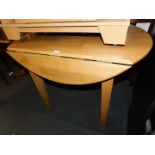 A beech drop leaf kitchen table, 78cm high, 65cm wide, 103cm extended, 105cm deep.