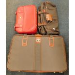 An Antler suitcase, holdall and a red leatherette case.