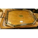 An Edwardian oak tray with silver plated gallery and another. (2)