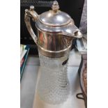 A moulded glass and silver plated claret jug.