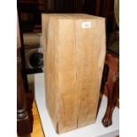 An oak block table or stand, 59cm high, 23cm wide, 24cm deep.