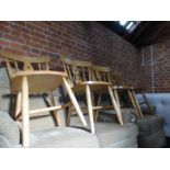 A set of four beech kitchen chairs.