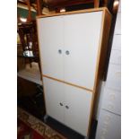 An IKEA white melamine four door office cupboard, with birch interior, 175cm high, 85cm wide, 42cm