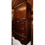 An Art Deco style oak tallboy, with two cupboard doors over four drawers, 150cm high, 82cm wide,