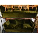 A pair of 1970's three seater sofas, upholstered in green draylon, each 202cm long.The upholstery in