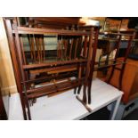 A pair of Edwardian mahogany towel rails, 89cm high, 70cm wide, 26cm deep., together with another