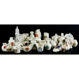 A collection of Goss and other crested china, to include a teapot stand, various ancient vessels,