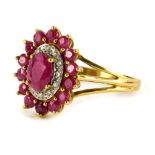 A floral cluster dress ring, set with various rubies and tiny diamonds, on a three row split