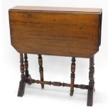 An Edwardian walnut Sutherland table, the rectangular top with canted corners, on turned supports,