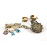 A small group of jewellery, comprising a pair of silver gilt hoop earrings, a George IV coin brooch,