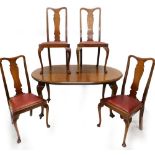 An early 20thC mahogany extending dining table, the top with a moulded edge and rounded ends, on