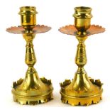A pair of late 19th/early 20thC brass and copper Arts & Crafts candlesticks, each with a