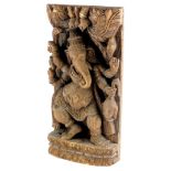 A decorative Indian panel, carved in the form of Ganesh, 50cm x 25cm.