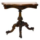 A Victorian walnut and burr walnut card table, the serpentine shaped top with a moulded edge on a