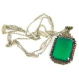 A silver and marcasite pendant, with rectangular cut green jade, with marcasite Art Deco style