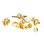 A group of earrings, comprising a pair of 9ct gold hoop earrings, various gold plated earrings,