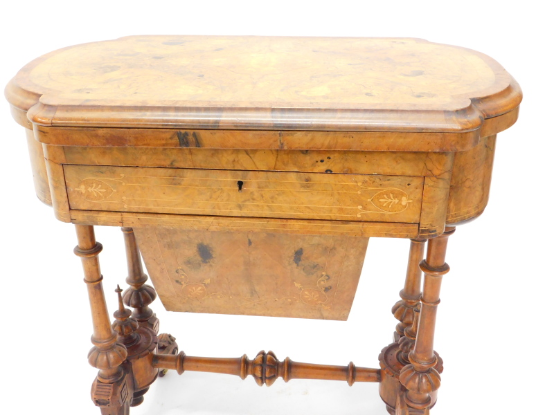 A Victorian walnut games/work table, the quarter veneered top with a burr yew crossbanded border and - Image 2 of 4