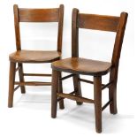 A near pair of beech child's Windsor chairs, each with turned legs and supports.