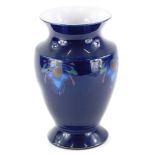 A Denby vase, decorated with Art Nouveau motifs on a cobalt blue ground, printed marks to underside,