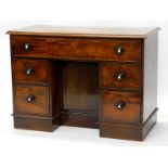 A Victorian kneehole desk, with a rectangular top with a moulded cornice, above a frieze drawer